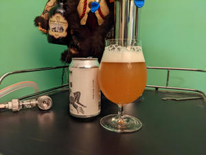 A can of Brookeville Beer Farm Dewpoint next to a tulip glass filled with the can's contents